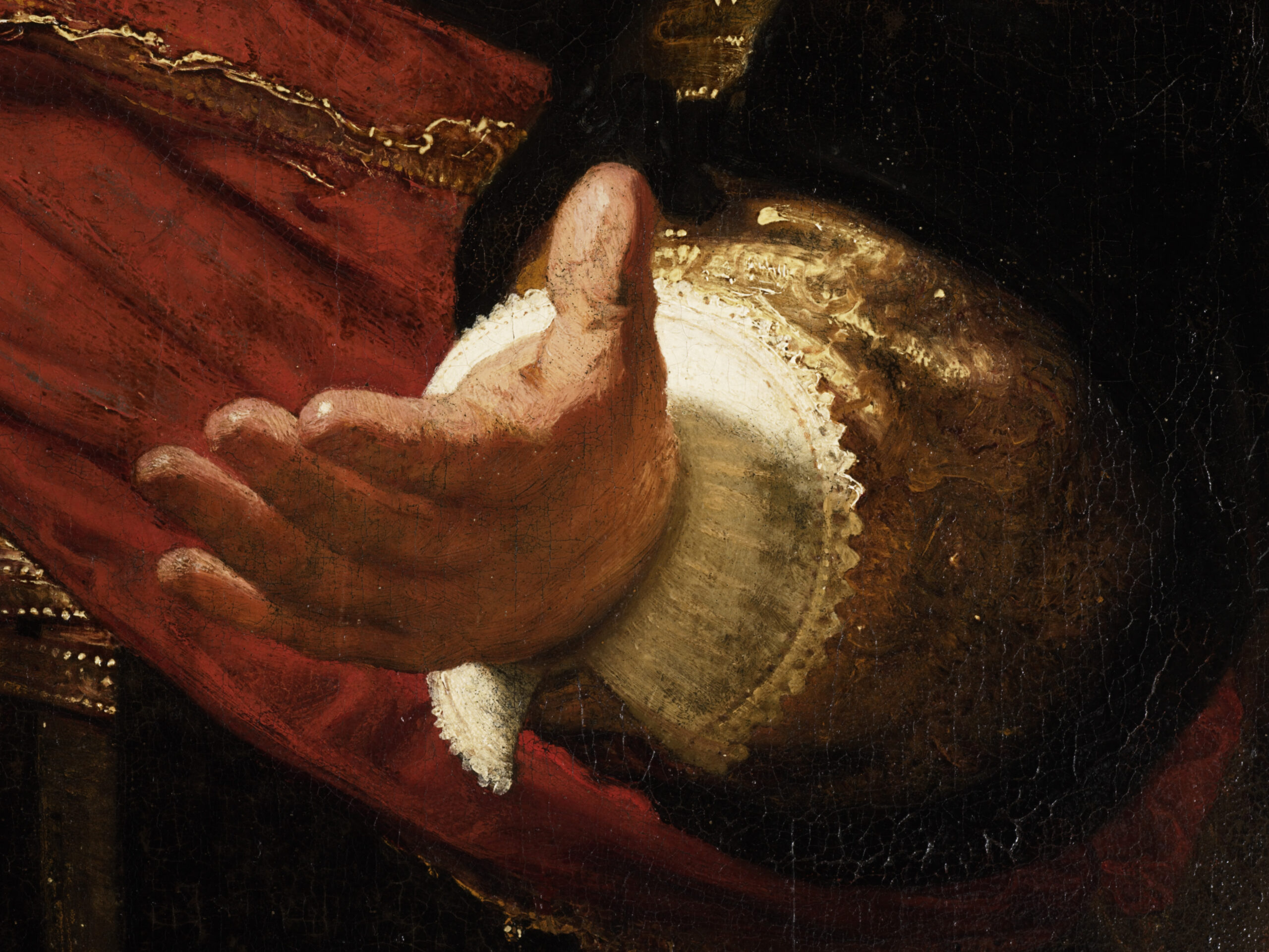 図版: 隊長の手の影が指し示すアムステルダム市の紋章（×印） - 出典: アムステルダム国立美術館 (Public Domain)